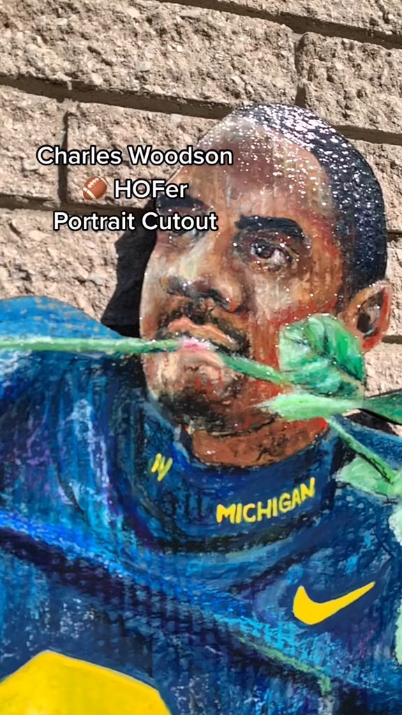 Video of the hand-cut and hand-painted Charles Woodson portrait cutout in his Michigan jersey with a rose in his mouth