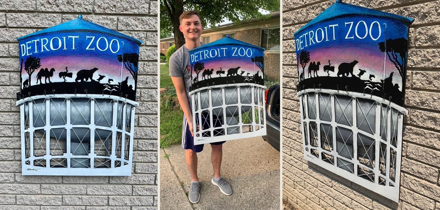 Detroit Zoo water tower, a hand-cut and hand-painted piece with animal silhouettes at sunset: on a brick wall, held by the customer, and an angled view